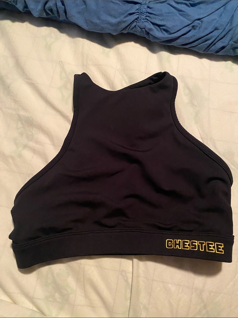 The Chestee w/ OUTWOD black High Neck Sports Bra w/ pride detail on back